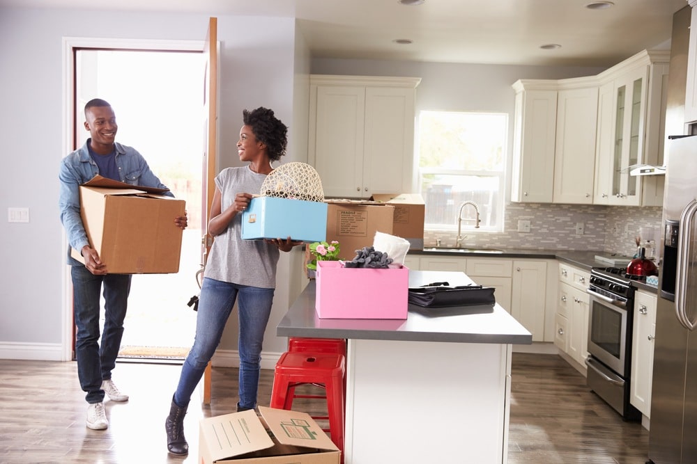 A couple enjoying their new home, thanks to Liberty Moving's reliable and professional moving services, making their move to Birmingham, AL effortless.